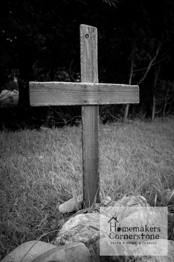 Nailing Jesus to the Cross Black and white photo of old wooden cross.