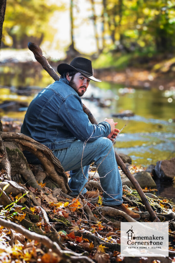 David Robertson Jr David Robertson, Amelia's husband sitting on a creek bank in the Fall.